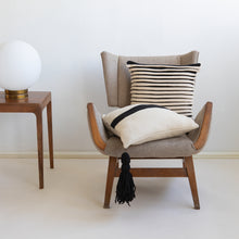 Load image into Gallery viewer, Our striped cushion is not like any other striped cushion. Thanks to special knitting techniques, three-dimensional fabric fold stripes are created.  Disclaimer: Every cushion is individually knitted and sewn by hand to ensure the highest level of comfort and long-lasting quality, which means you may find slight variations in design and size.  Cushion filling included. 43 x 43 cm 100% polyester