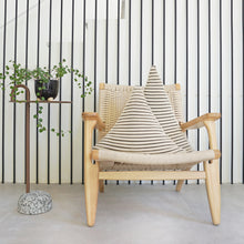 Load image into Gallery viewer, The Triangle Cushion is the perfect statement piece for your sofa or bedroom thanks to its geometric shapes.  Available in two different sizes.  Disclaimer: Every cushion is individually knitted and sewn by hand to ensure the highest level of comfort and long-lasting quality, which means you may find slight variations in design and size.  Cushion filling included. 45H x 54 cm 100% polyester