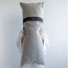 Load image into Gallery viewer, Add an organic element to your environment  with our long and cozy cushions.  Disclaimer: Every cushion is individually knitted and sewn by hand to ensure the highest level of comfort and long-lasting quality, which means you may find slight variations in design and size.  Cushion filling included. 35 x 85 cm 100% polyester
