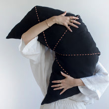 Load image into Gallery viewer, The ultimate piece to sit back and chill. The unique shape of the cushion provides your back and neck the ultimate support.  Disclaimer: Every cushion is individually knitted and sewn by hand to ensure the highest level of comfort and long-lasting quality, which means you may find slight variations in design and size.  Cushion filling included. 40 x 72 cm 100% polyester