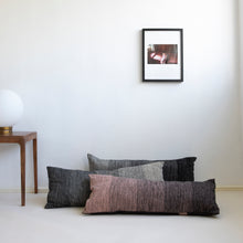 Load image into Gallery viewer, Add an organic element to your environment  with our long and cozy cushions.  Disclaimer: Every cushion is individually knitted and sewn by hand to ensure the highest level of comfort and long-lasting quality, which means you may find slight variations in design and size.  Cushion filling included. 35 x 85 cm 100% polyester
