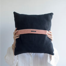 Load image into Gallery viewer, Add a little bit of style and personality to your home with the X cushion. By playing with the negative spaces to create a unique feeling, the X cushion offers timeless aesthetic with a bold repetitive pattern.  Disclaimer: Every cushion is individually knitted and sewn by hand to ensure the highest level of comfort and long-lasting quality, which means you may find slight variations in design and size.  Cushion filling included.  42 x 42 cm 100% polyester