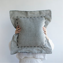 Load image into Gallery viewer, Offering an elegant and timeless design for your home with a different color on each side. This two-sided cushion gives you options to play with.  Disclaimer: Every cushion is individually knitted and sewn by hand to ensure the highest level of comfort and long-lasting quality, which means you may find slight variations in design and size.  Cushion filling included. 55 x 55 cm 100% polyester