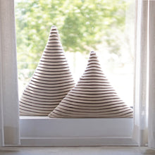 Load image into Gallery viewer, The Triangle Cushion is the perfect statement piece for your sofa or bedroom thanks to its geometric shapes.  Available in two different sizes.  Disclaimer: Every cushion is individually knitted and sewn by hand to ensure the highest level of comfort and long-lasting quality, which means you may find slight variations in design and size.  Cushion filling included. 60H x 55 cm 100% polyester