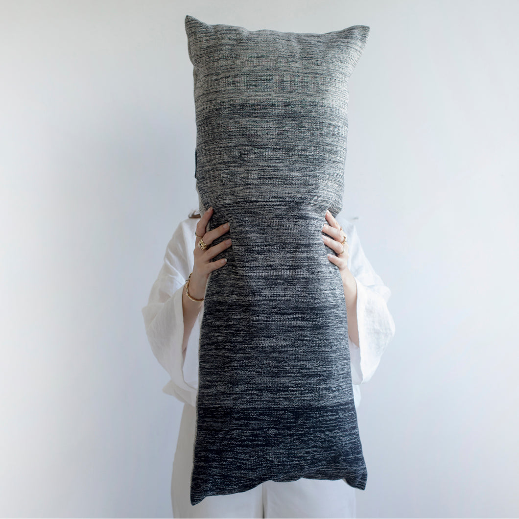 Add an organic element to your environment  with our long and cozy cushions.  Disclaimer: Every cushion is individually knitted and sewn by hand to ensure the highest level of comfort and long-lasting quality, which means you may find slight variations in design and size.  Cushion filling included. 35 x 85 cm 100% polyester